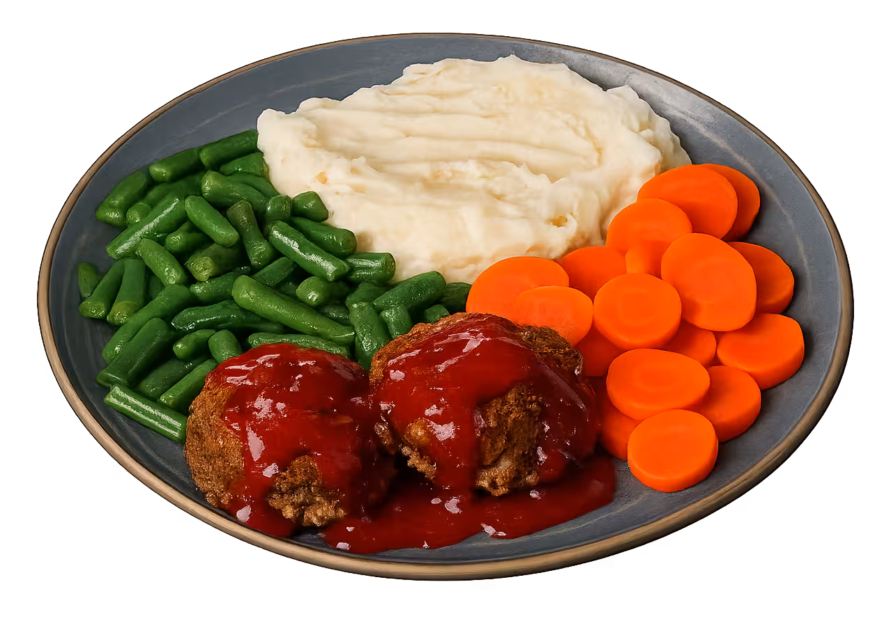 Meatloaf dinner with mashed potatoes, carrots, and green beans